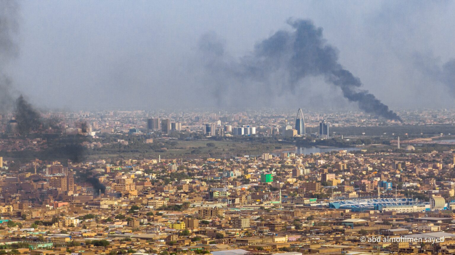 https://www.dabangasudan.org/wp-content/uploads/2023/08/Columns-of-smoke-rise-above-Khartoum-May-27-Photo-Abdel-Mohaimen-Sayed-Twitter.jpeg